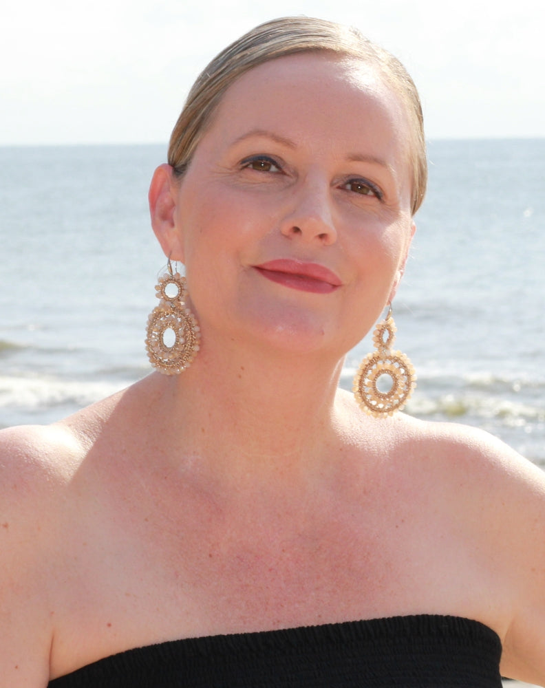 gold boho beaded earring by miss seafari shown how to elevate a black wardrobe basic