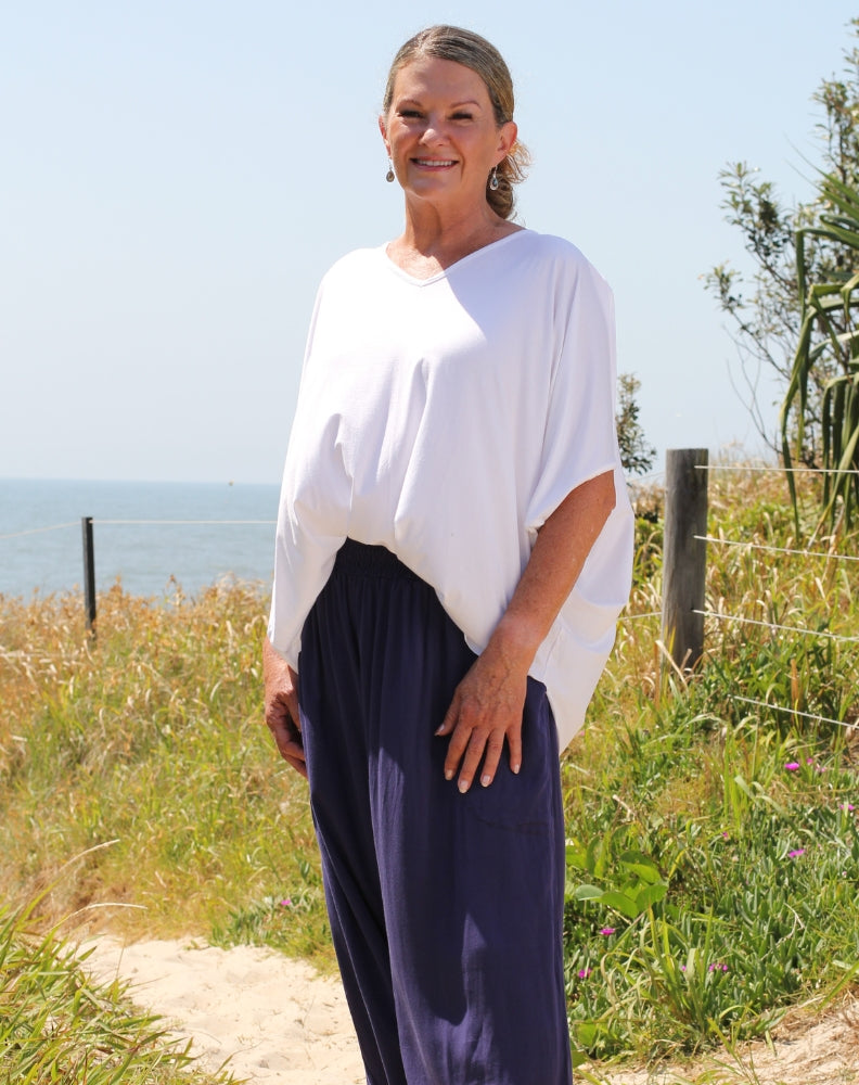 cold shoulder top in white modal by miss seafari worn tucked in styled as a drape top