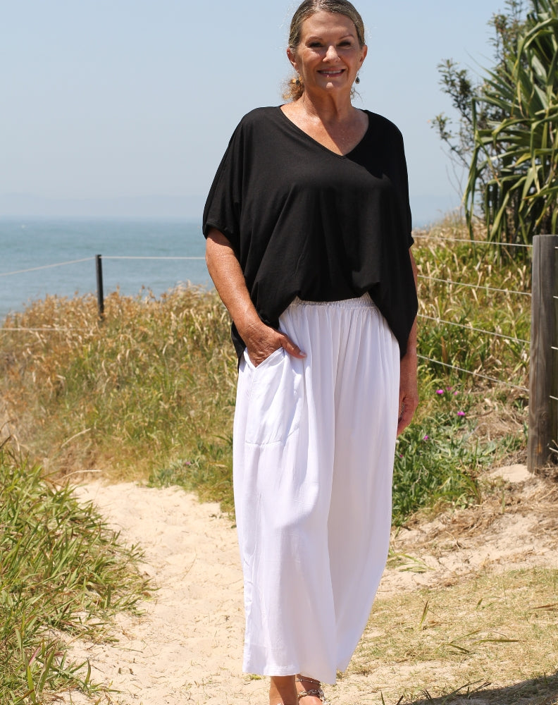 everyday pant in white by miss seafari worn with black modal top on size 10 mature woman
