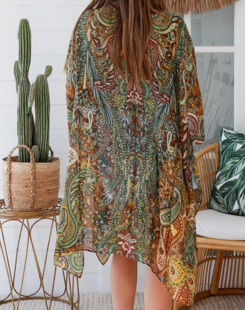 woman wearing kimono coverup with shorts in a home setting for weekend wear