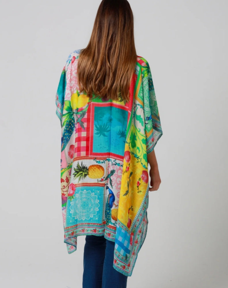 Woman wearing a tropical inspired holiday kimono jacket