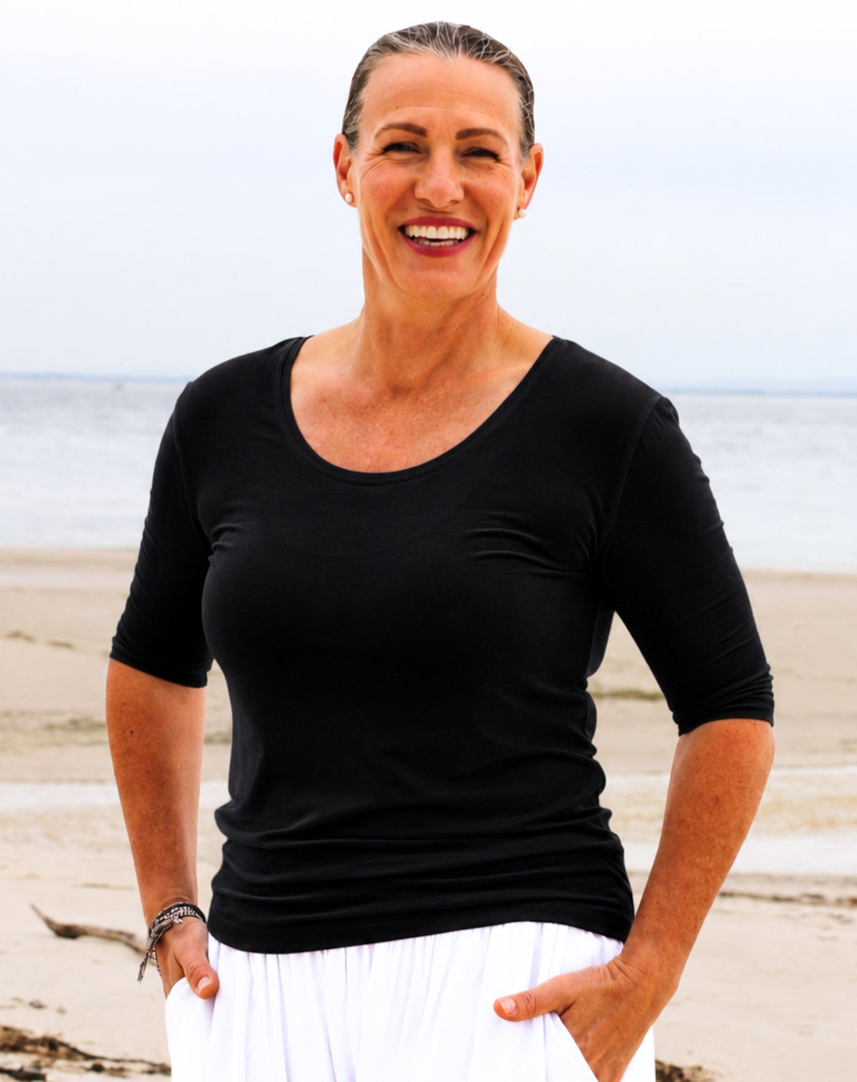 close up of round neckline of scoop tee in black modal jersey