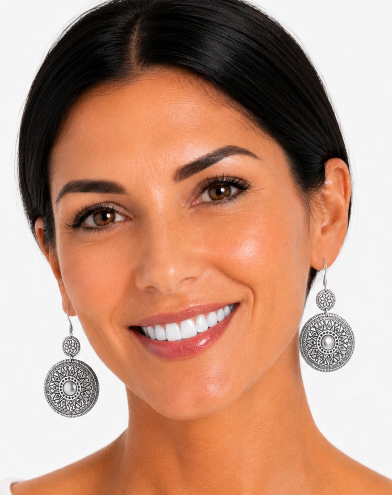 silver round disc earrings on model in studio