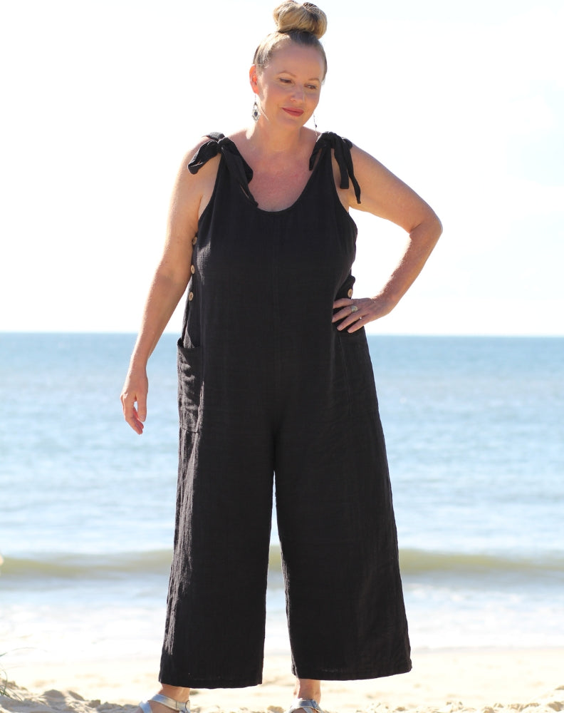 tiestrap jumpsuit in black cotton worn at beach holiday by size 16 woman