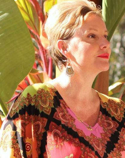amber and green indian style earrings by miss seafari worn to elevate kaftan dress for holidays