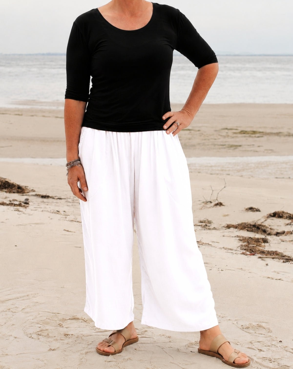 relaxed wide-leg culotte style pant worn with scoop tee and sandals