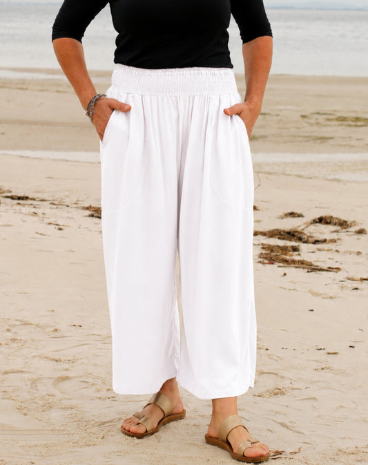 wide-leg white shirred waist 7/8 everyday pant in white worn at beach