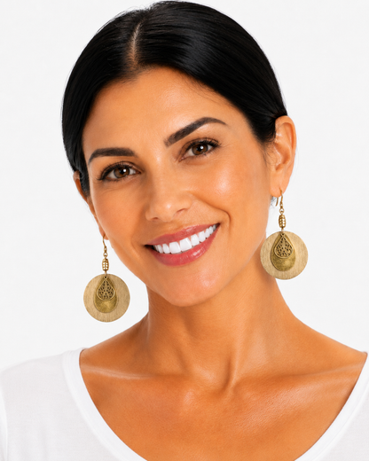 rustic boho golden disc earrings on woman in studio