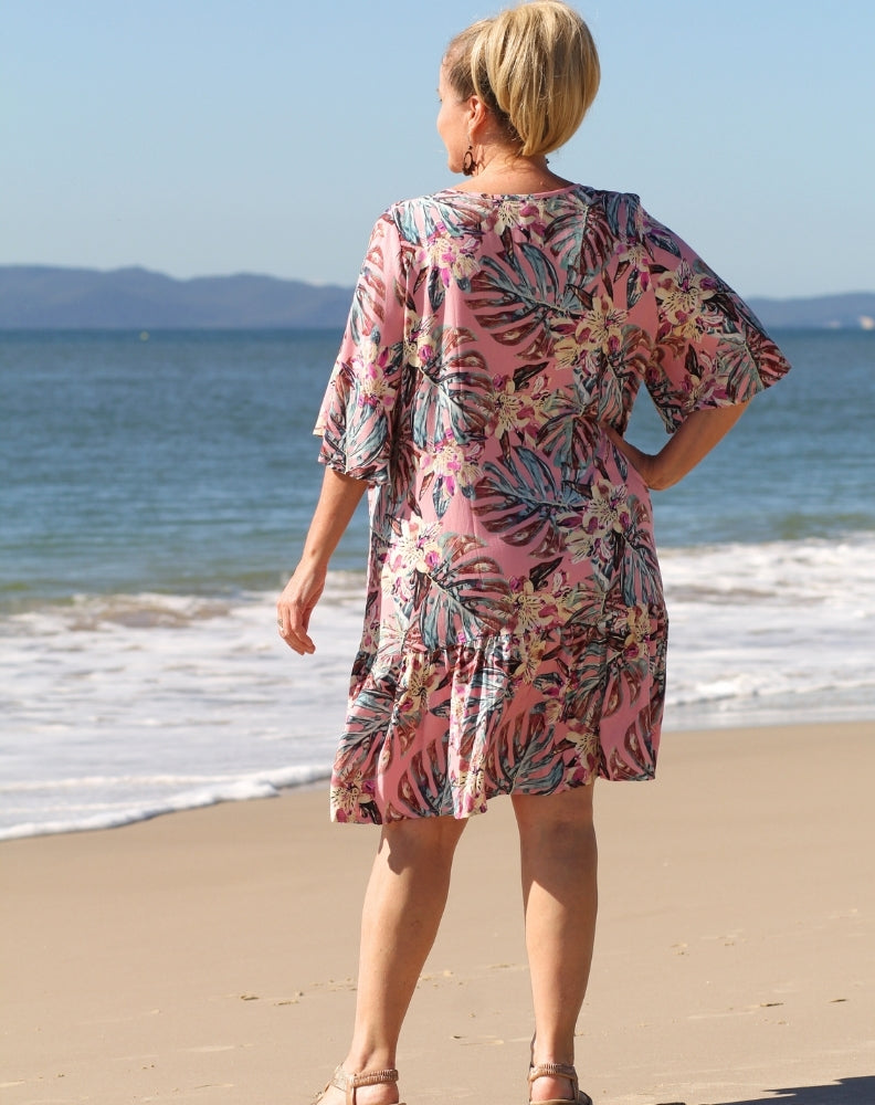 size 16 curve model wearing pink tropics dress in boho flutter dress