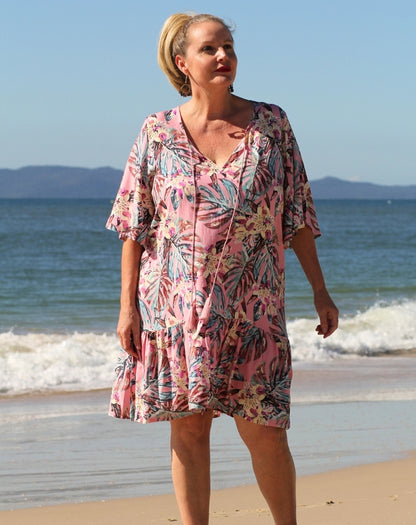 boho flutter dress in pink tropics showing modest knee length