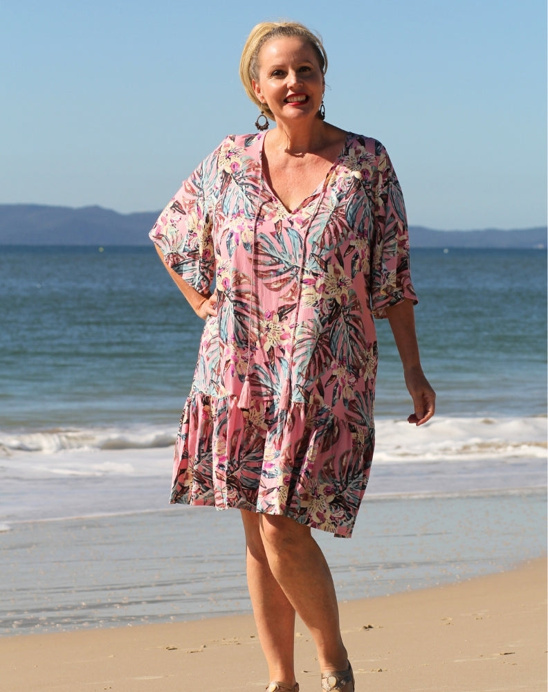 curve model wearing boho flutter dress in pink tropics