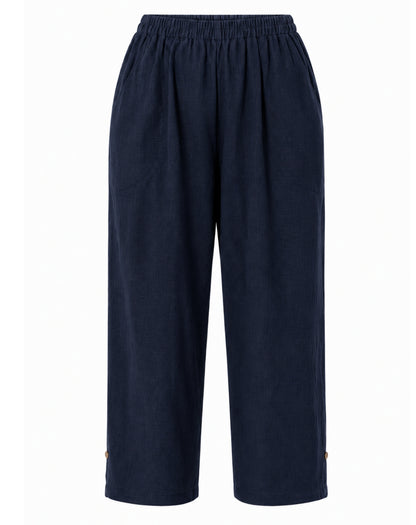 A pair of dark navy blue linen style cropped pants with an elastic waistband, shown against a plain white background.