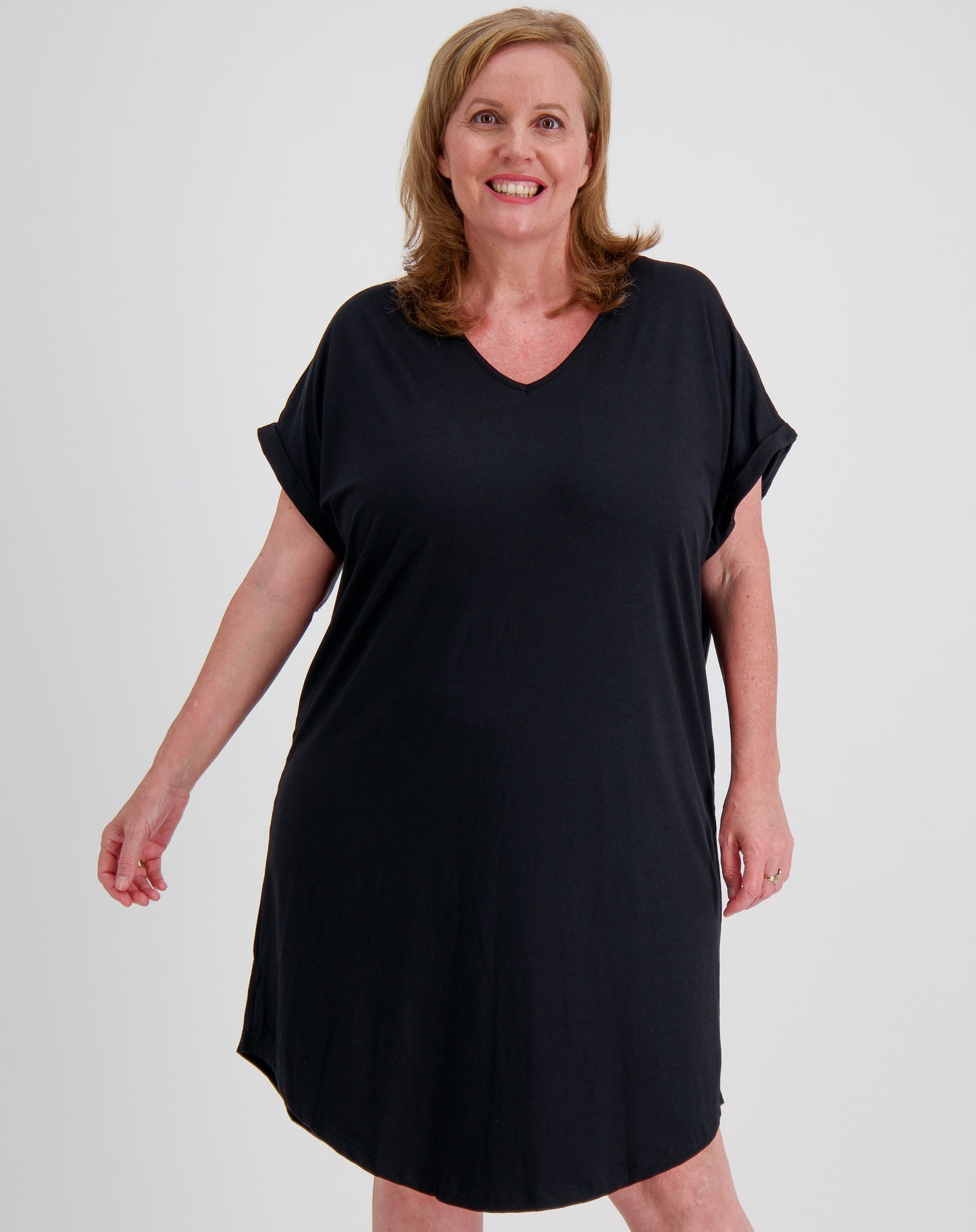 size 16 woman wearing a black tee dress  in black modal against a white background