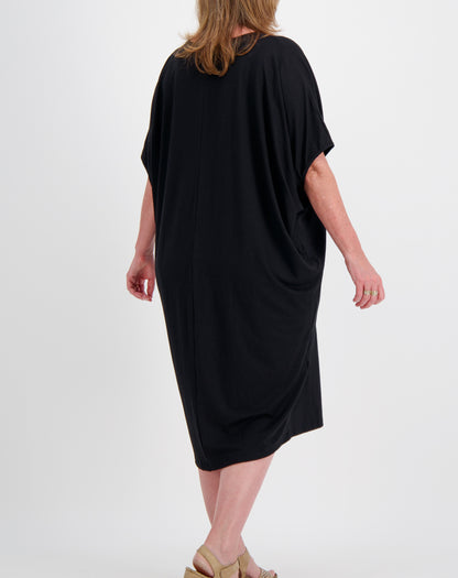 black comfort dress in black modal worn by a size 16 woman on a white background