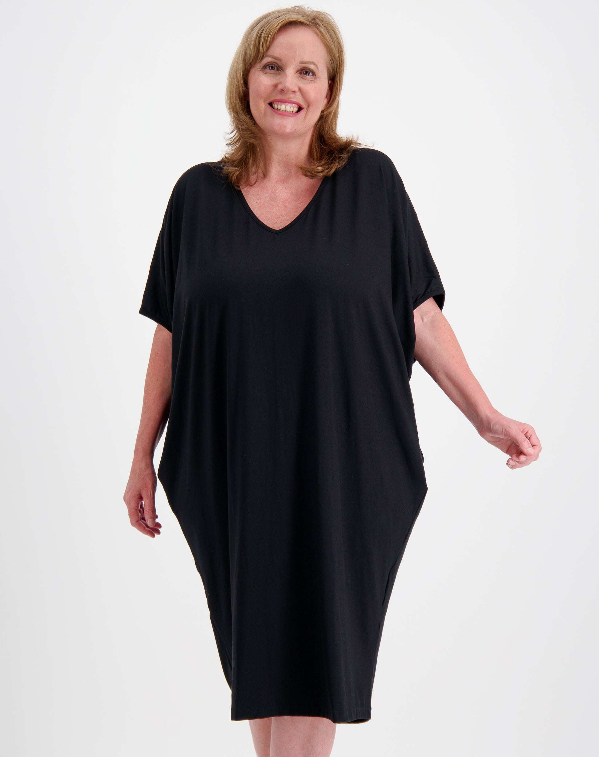 Woman wearing a black comfort dress in black modal by miss seafari on a white background