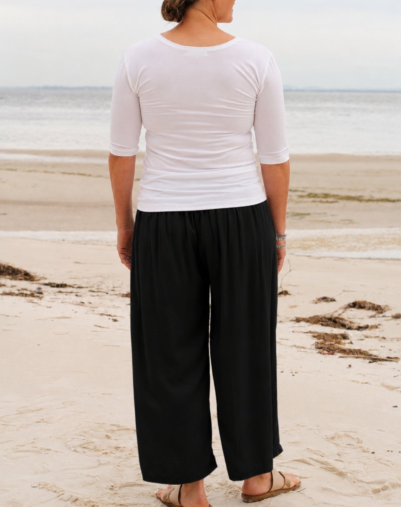 back view of everyday pant in black with wide leg in relaxed rayon twill fabric
