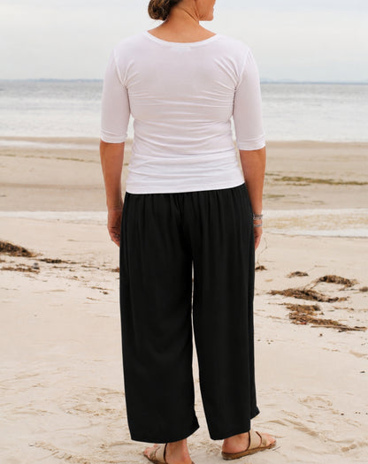 back view of everyday pant in black with wide leg in relaxed rayon twill fabric