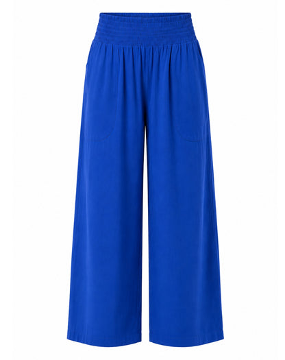Bright cobalt blue wide-leg cropped pants with an elastic waistband, shown against a plain white background.