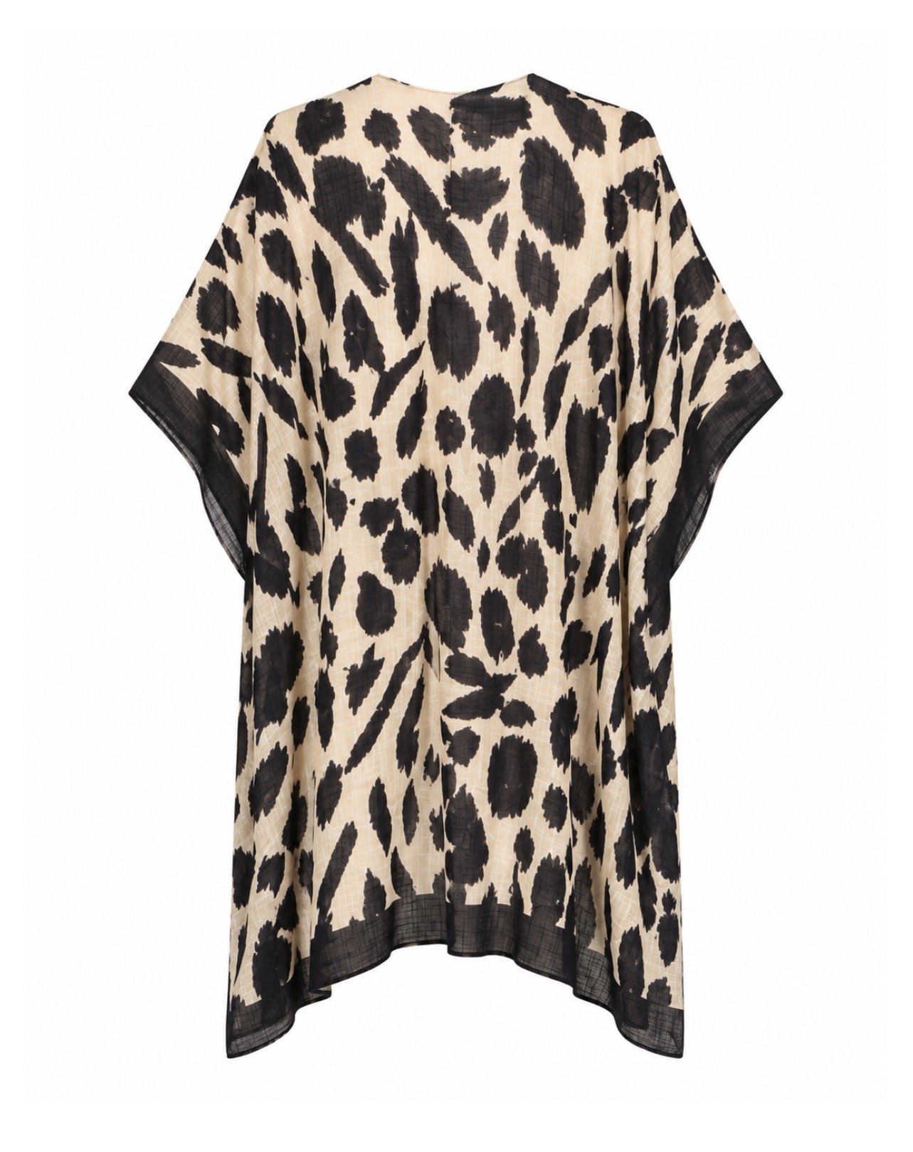 A loose, short-sleeved kaftan-style top with an abstract black and beige print, featuring solid black trim along the wide sleeves and hem, shown against a plain white background.