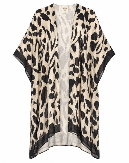 A lightweight open-front kaftan or poncho-style cardigan with an abstract black and beige animal-inspired print, displayed on a clean white background.