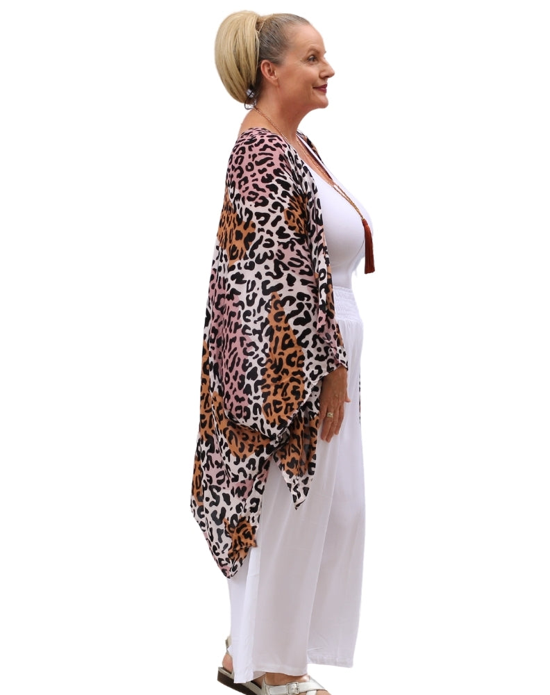 kimono jacket in pink leopard side view on size 16 woman worn over white resort out fit