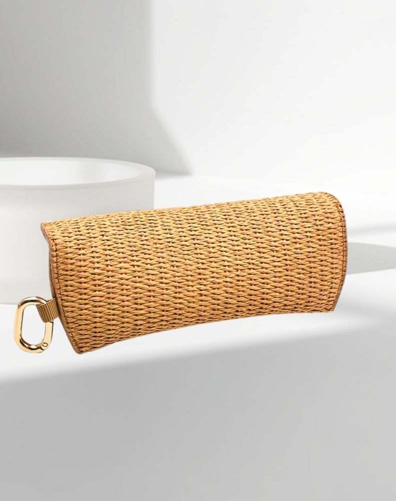 back of rattan glasses case showing gold clasp and clip for handbag