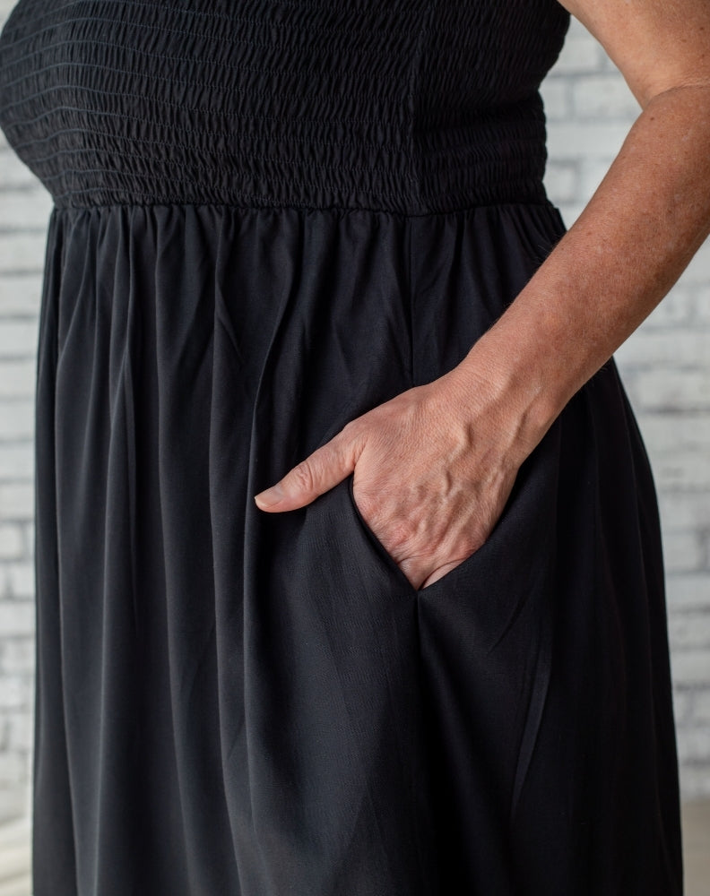 shirred black sundress showing pockets