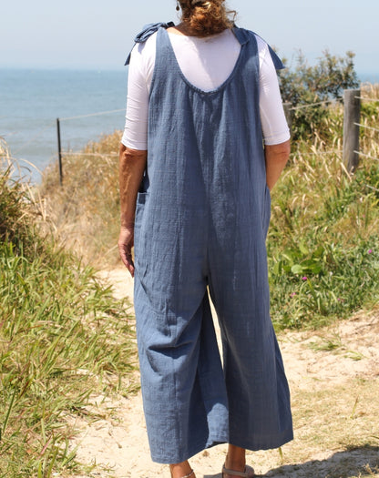 tiestrap jumpsuit in denim showing back and crinkle cotton texture