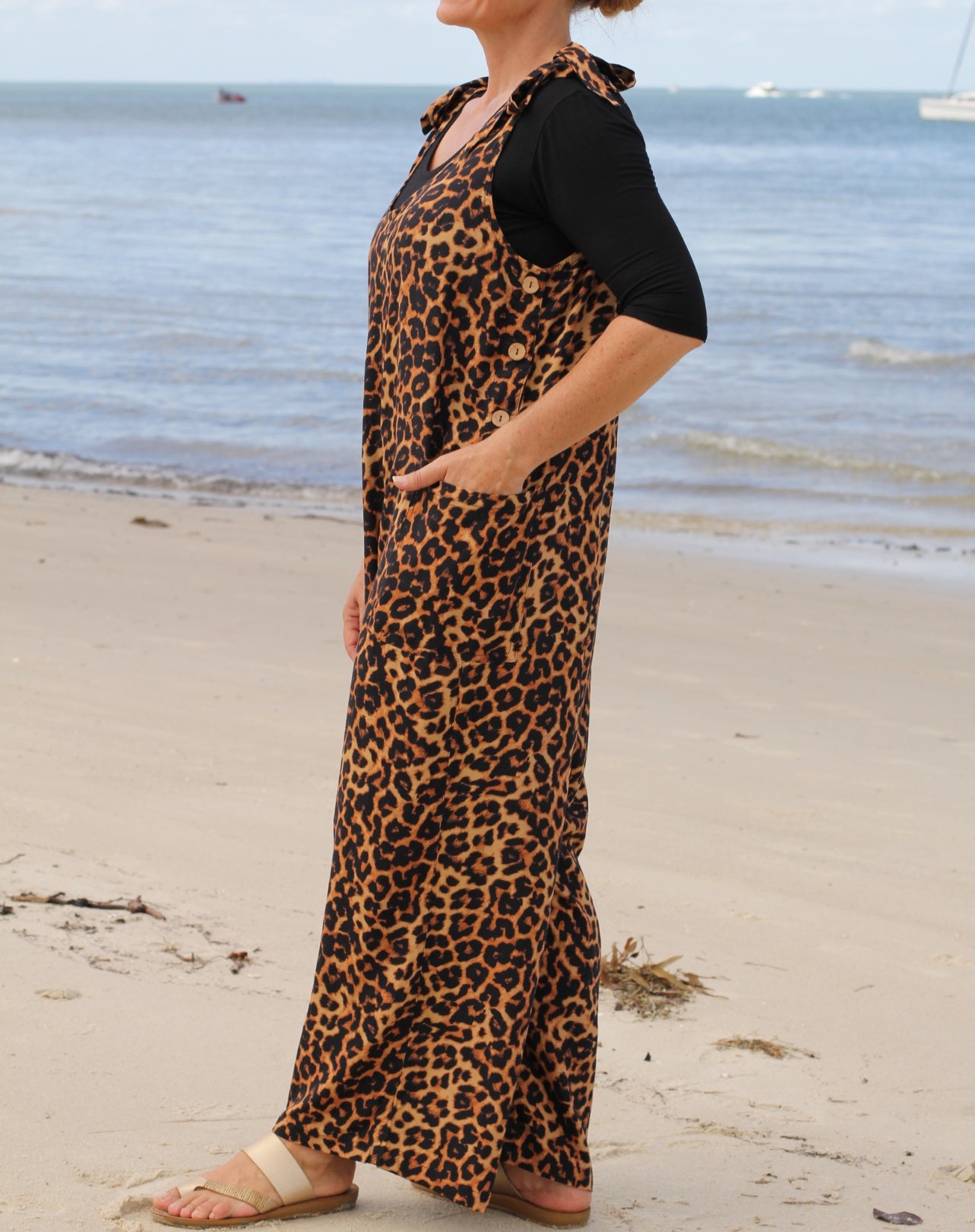 leopard jumpsuit showing details of side buttons