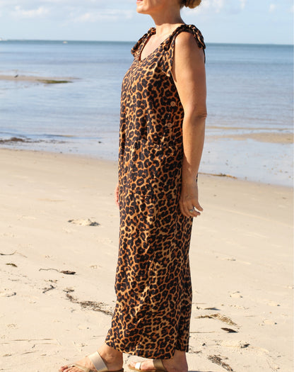 side view of miss seafari tie strap jumpsuit in exclusive leopard print