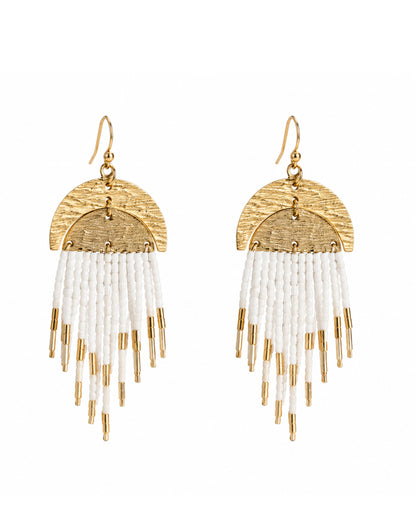 A pair of coastal chic gold and white beaded fringe dangle earrings on a plain white background.