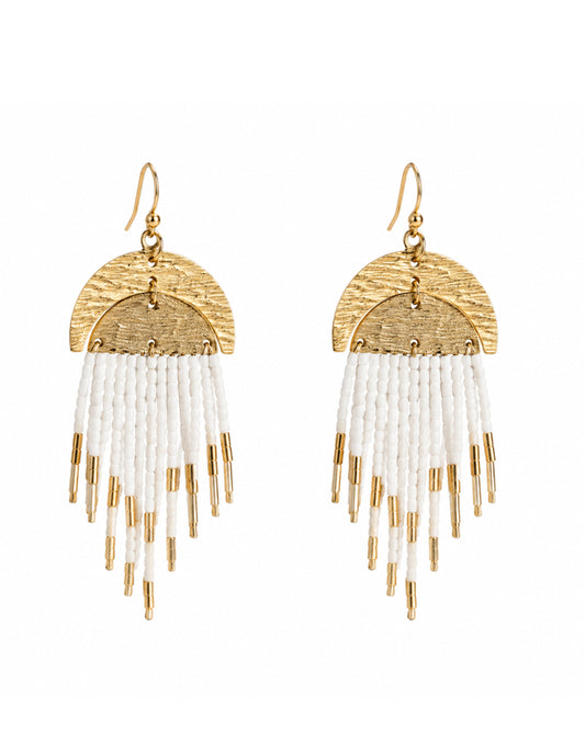 A pair of coastal chic gold and white beaded fringe dangle earrings on a plain white background.